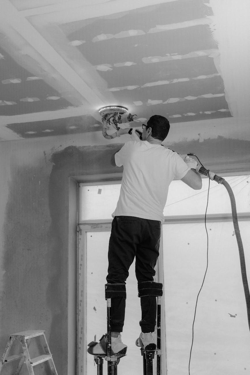 Cabinet refinishing workshop showing detailed sanding and preparation work